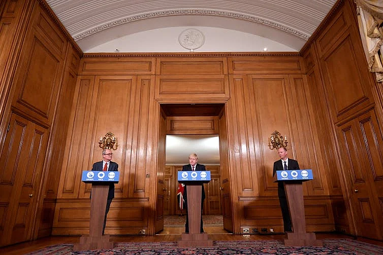 Prime Minister Boris Johnson addressed the nation with his chief advisors to announce new restrictions. 