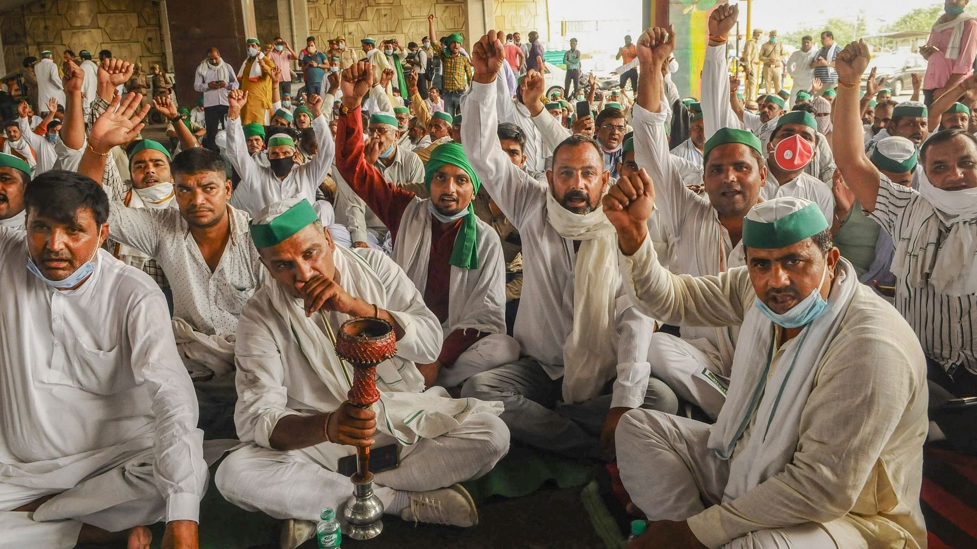 Bharatiya Kisan Union (BKU) leaders and farmers stage a protest against the central government policies on the first day of the Parliament session, at Delhi-UP border, Monday, 14 September, 2020.