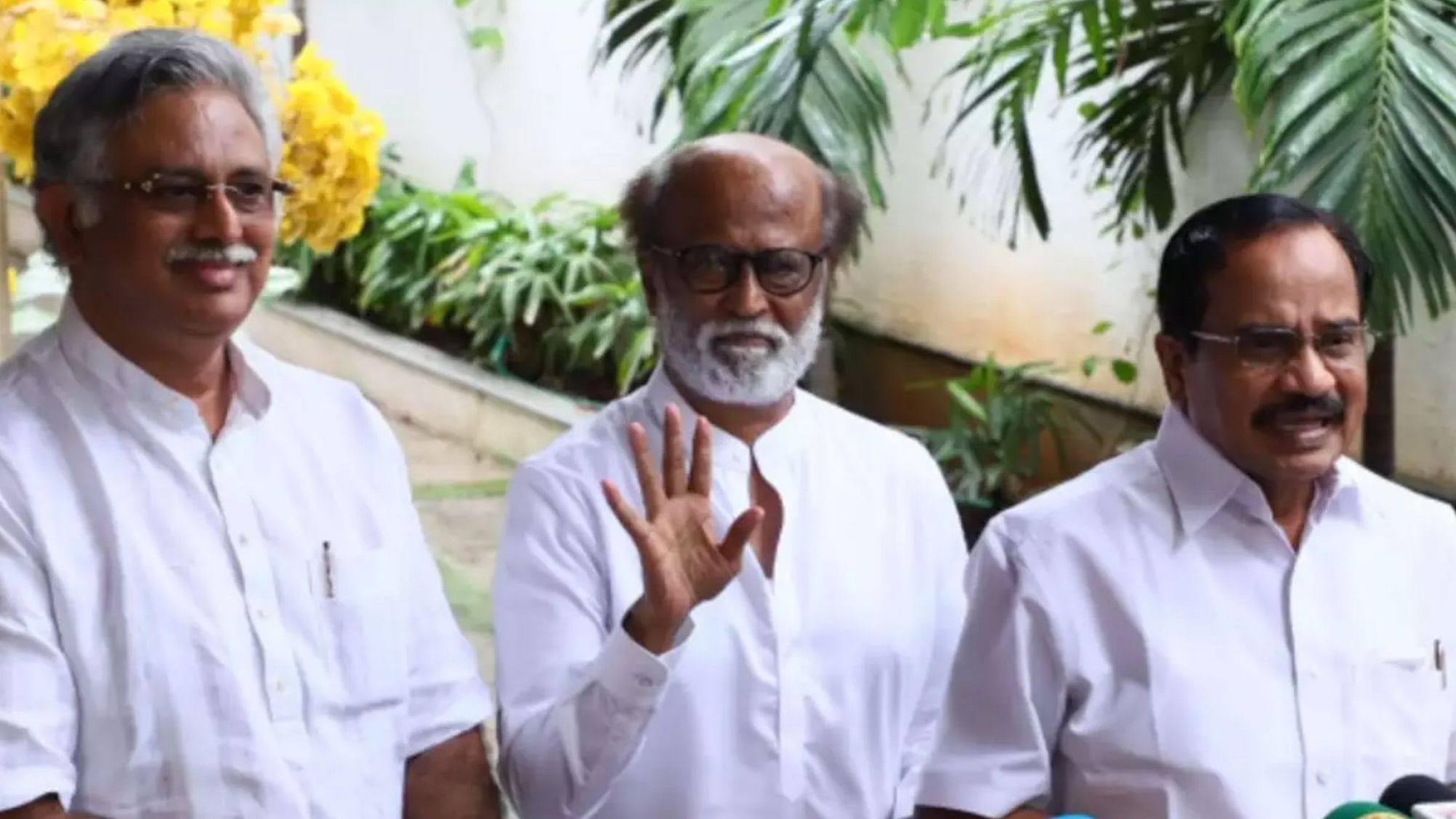 Rajinikanth with Tamil Aruvi Manian (right) and Arjuna Murthy (left)