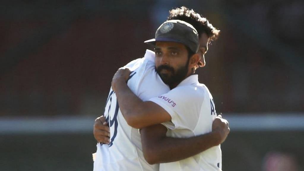 India captain Ajinkya Rahane hugs R Ashwin after the Sydney Test.&nbsp;