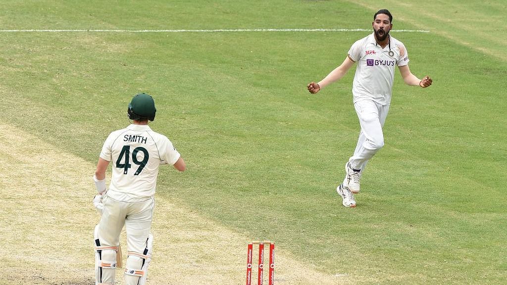 Mohammed Siraj celebrates the wicket of Steve Smith on Day 4 at the Gabba.&nbsp;