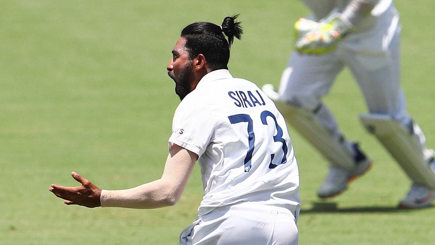 Mohammed Siraj celebrates a wicket on Day 4 at the Gabba
