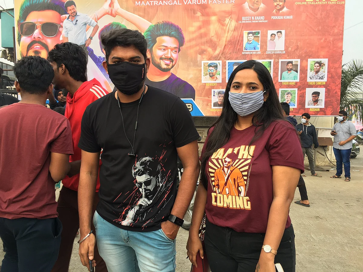 Fans of Vijay wear 'Vaathi coming' t-shirts.