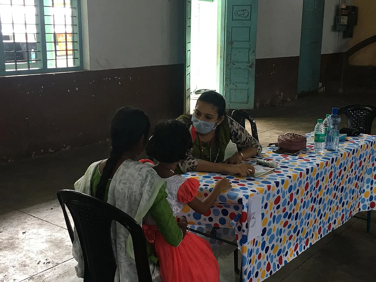 A doctor conducting check-ups at a medical camp in North Paravur, one of the worst affected ones in Kerala.