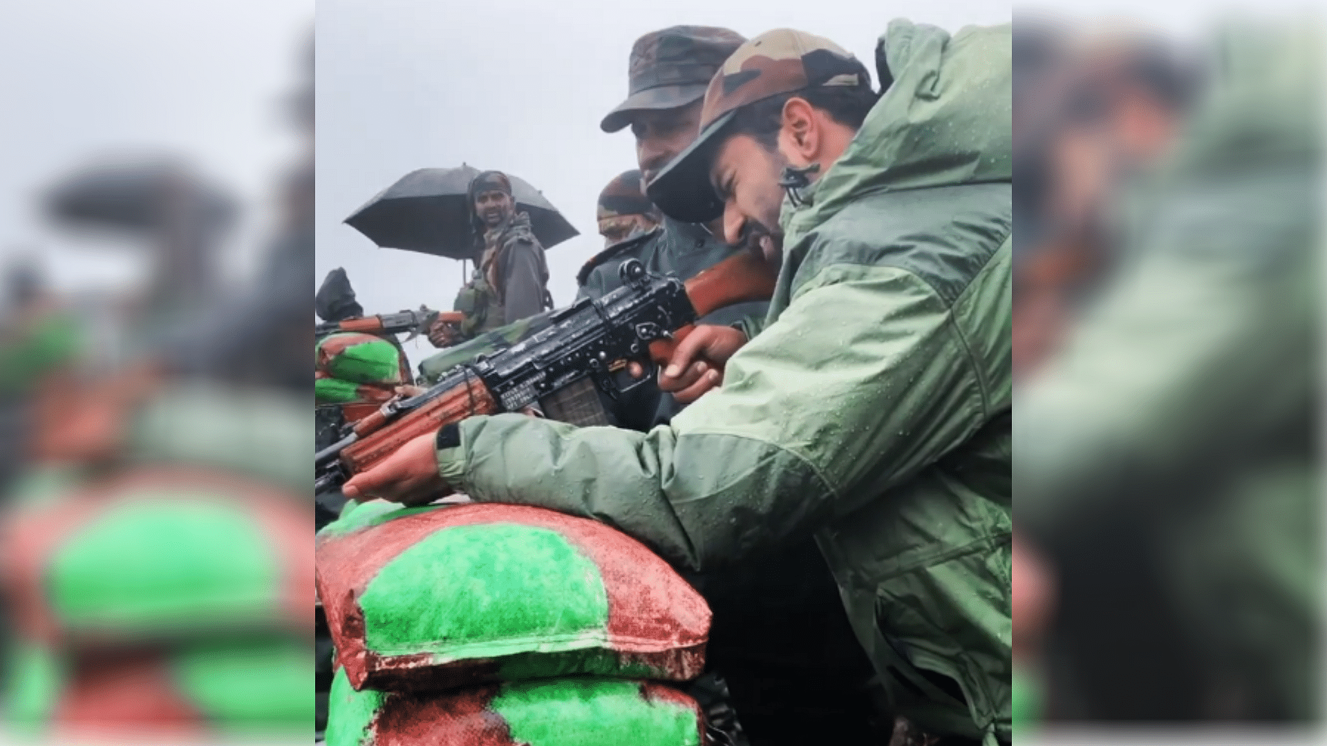 A soldier teaches Vicky Kaushal how to shoot a rifle.