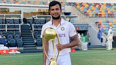 T Natarajan poses with the Border-Gavaskar Trophy at the Gabba. 