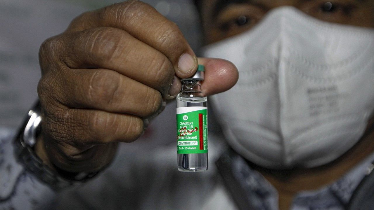 A health worker shows the ‘Covishield’ vaccine after the arrival of the first batch of the vaccines from the Serum Institute of India at the Civil Hospital in Ahmedabad. Image used for representational purposes only.