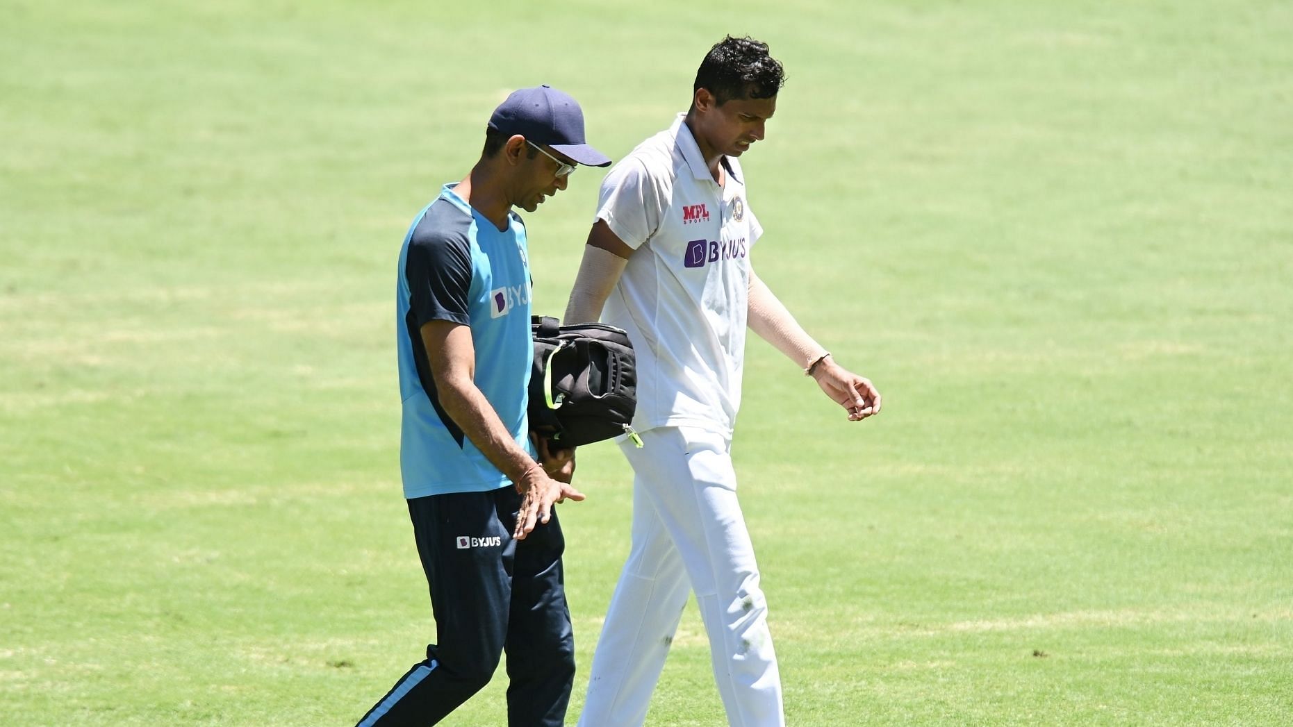 Pacer Navdeep Saini walks off due to an injury on Day 1 at Brisbane.&nbsp;