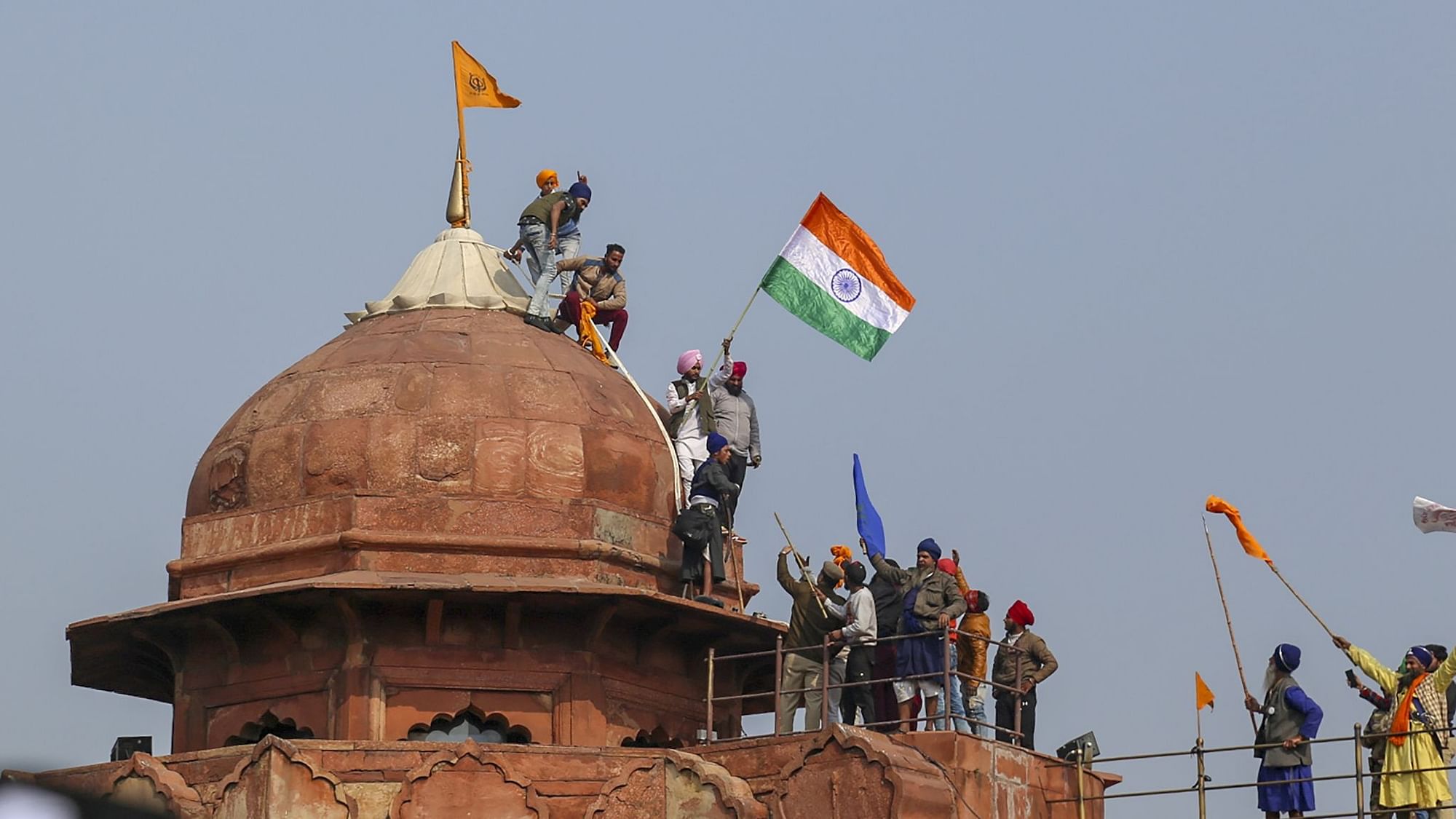 Protesting farmers and their supporters at the Red Fort in New Delhi, on Tuesday, 26 January.