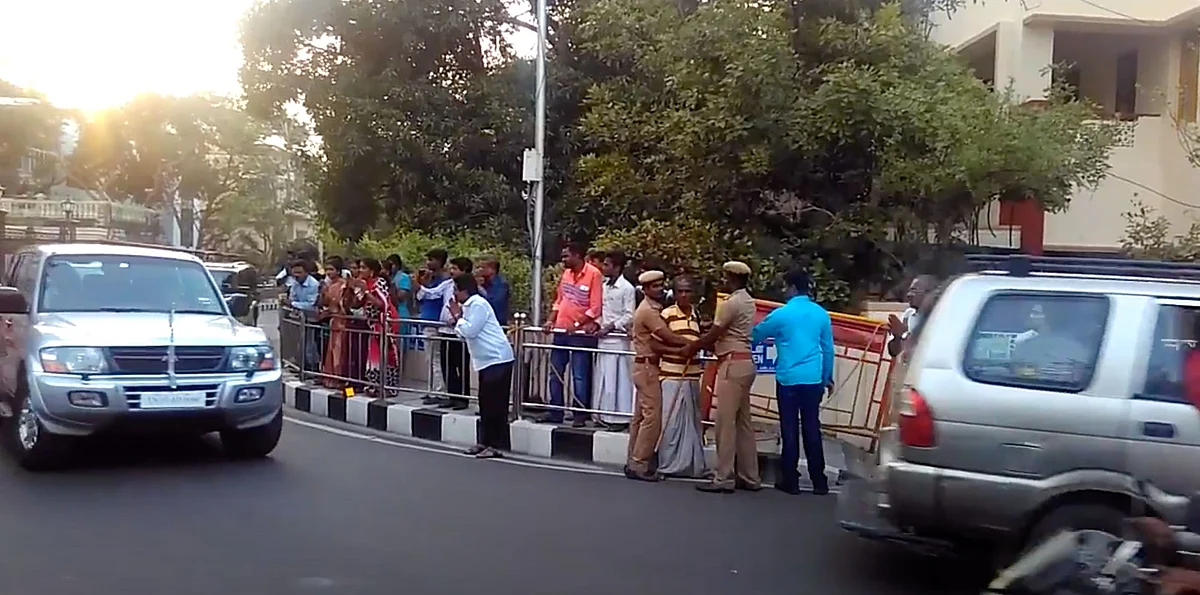 People bow to Jayalalithaa as she leaves her residence in her car. Photo taken on 6 March 2016.