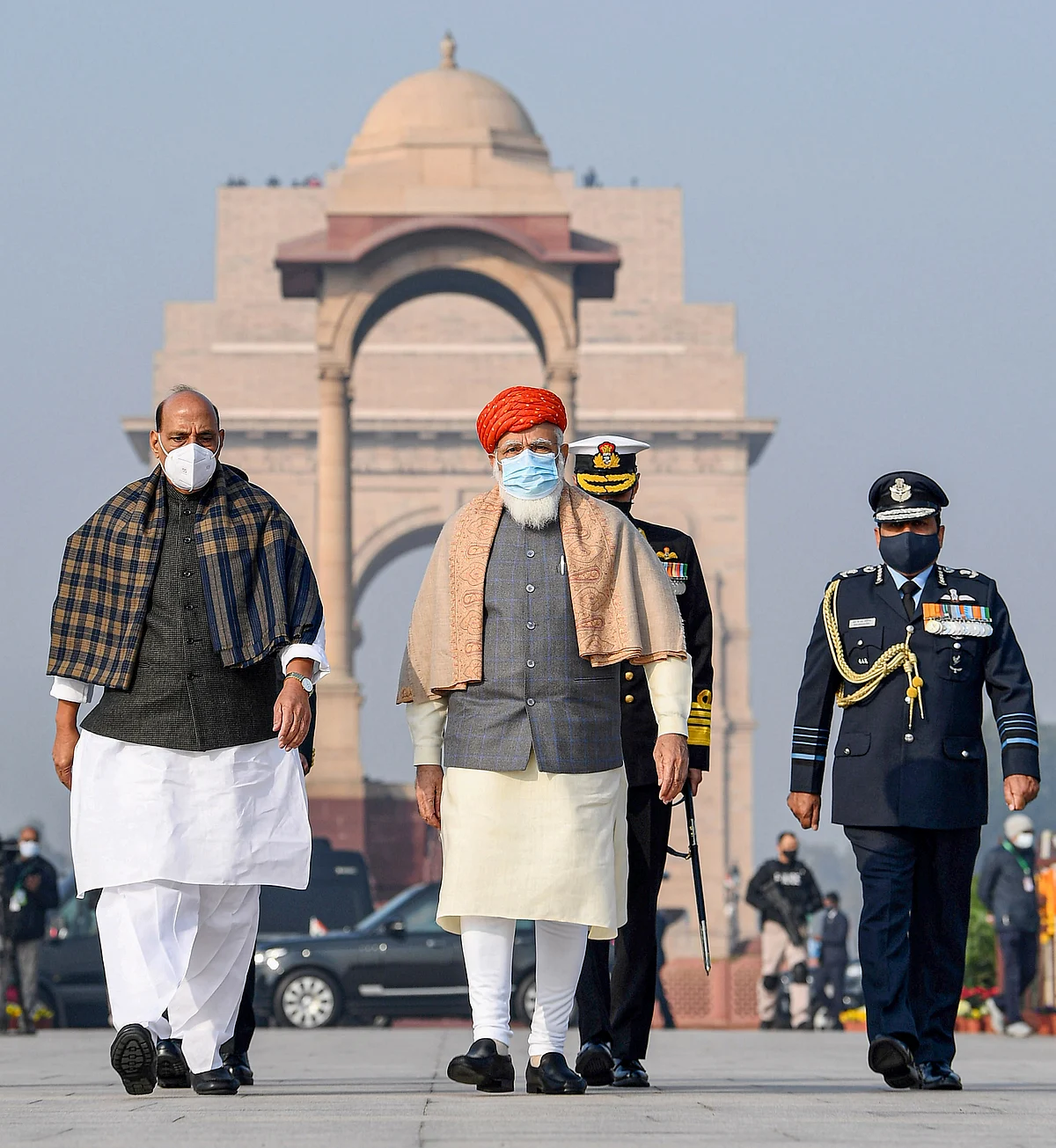 Prime Minister Narendra Modi and Defence Minister Rajnath Singh arrive at the National War Memorial, on the occasion of the 72nd Republic Day Parade 2021, in New Delhi, Tuesday, 26 January 2021.