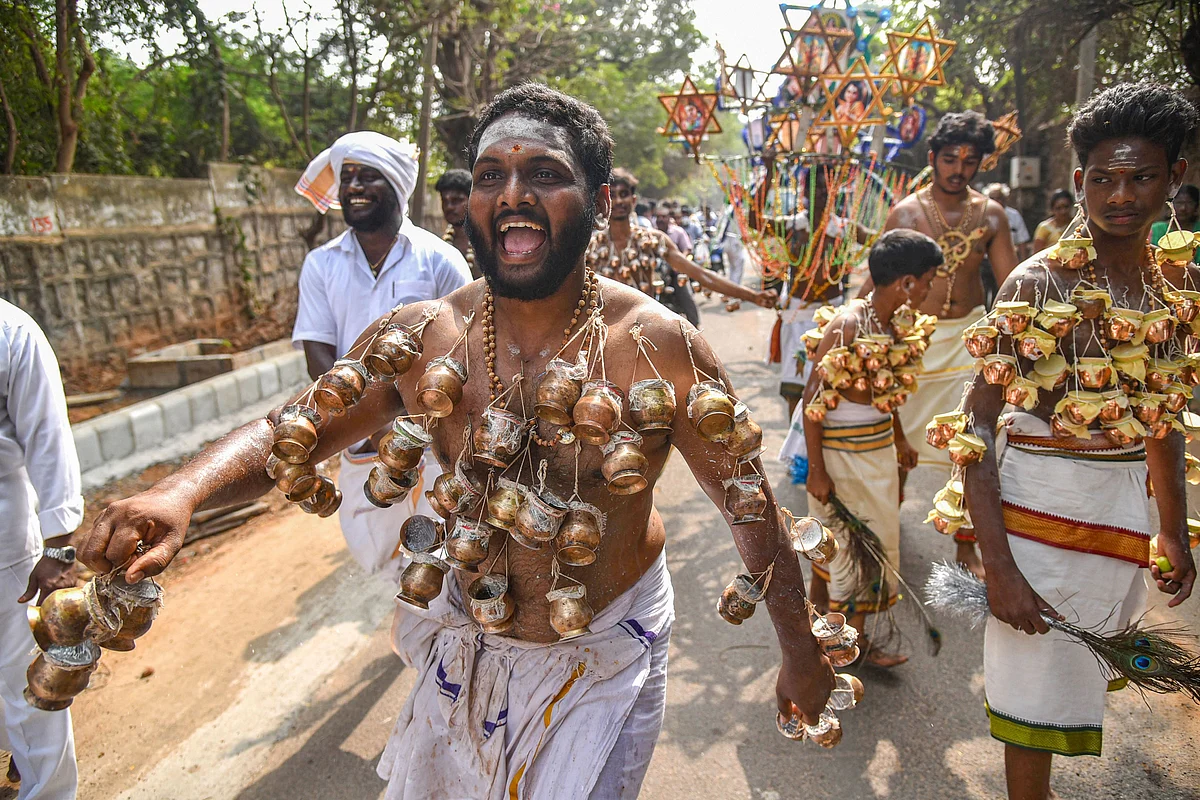 A Hindu devotee with his body pierced with pots takes part in a procession in connection with the Thaipusam festival, in Visakhapatnam, Thursday, 28 January 2021.