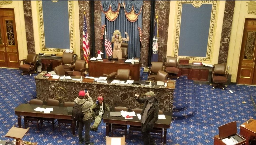 Visuals showed Trump supporters marching through the Capitol, some even sitting on the Speaker’s seat in the Senate.