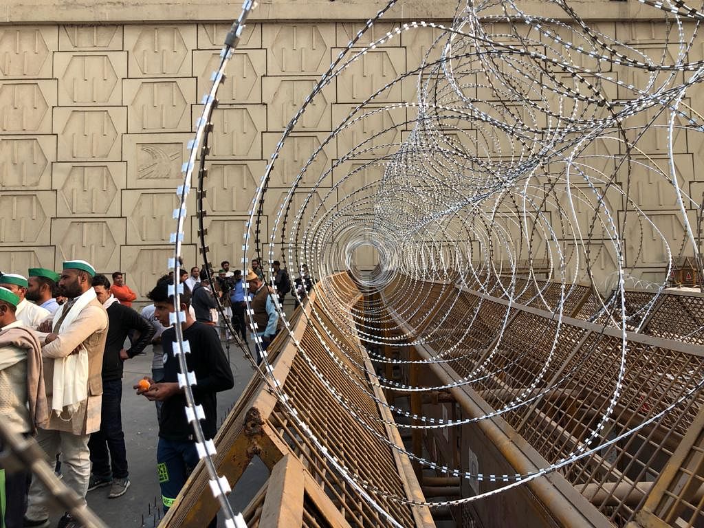 The iron barricades have now been further fortified by concertina wires as well as double layers of concrete slabs.