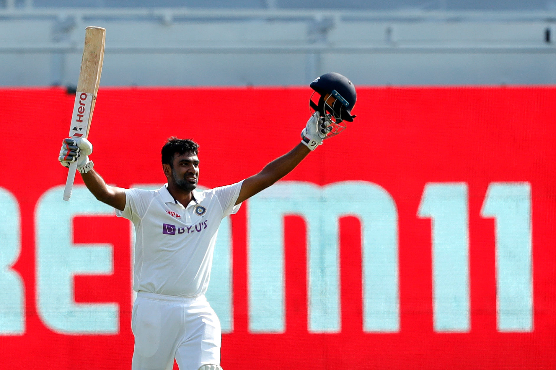 Ravichandran Ashwin of India  celebrates after scoring a hundred during day three of the second PayTM test match.