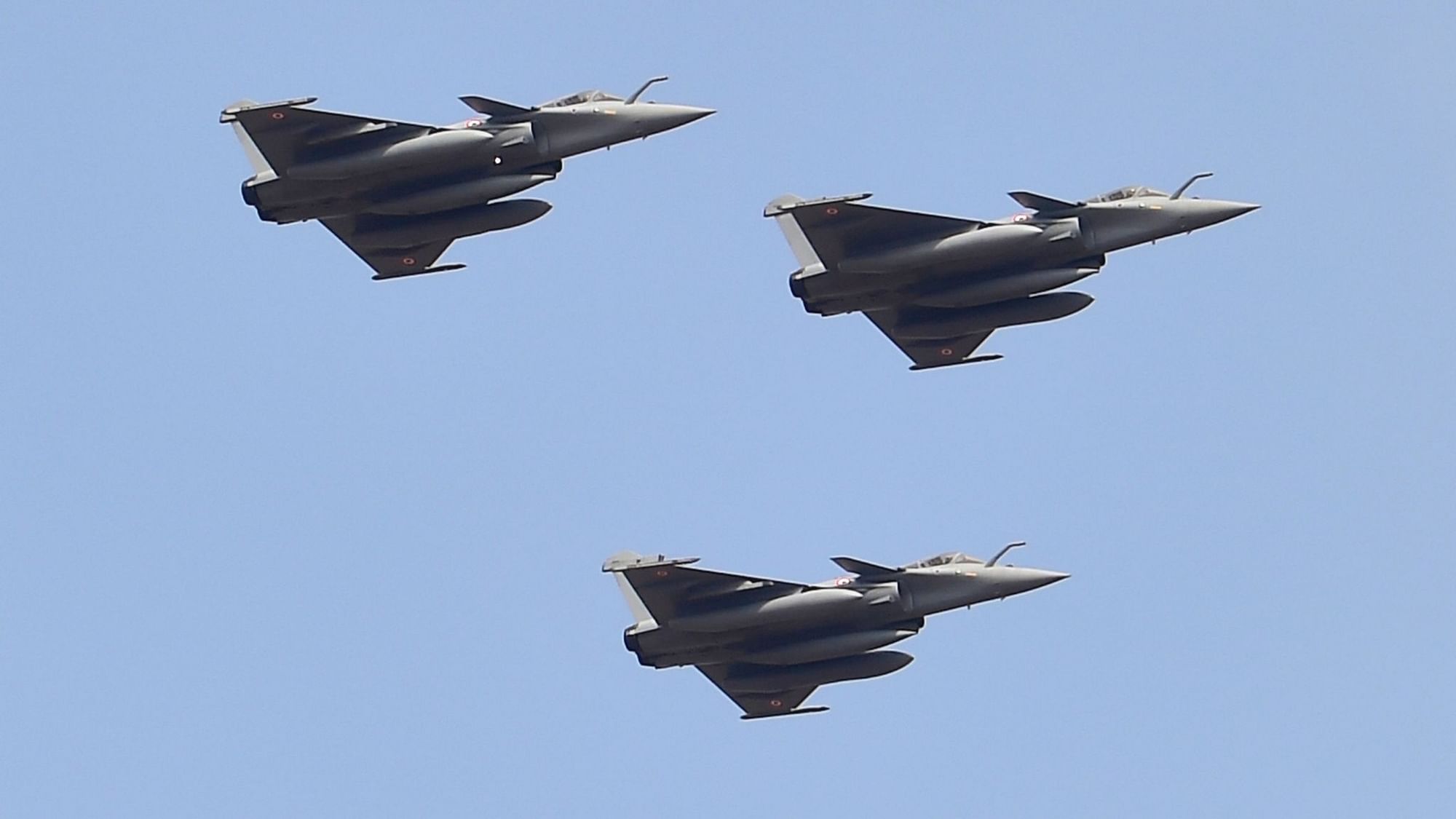 Indian Air Force’s Rafale aircrafts fly in a formation over Yelahanka air base during the inauguration of the 13th edition of Aero India, in Bengaluru, Wednesday, 3 February 2021.