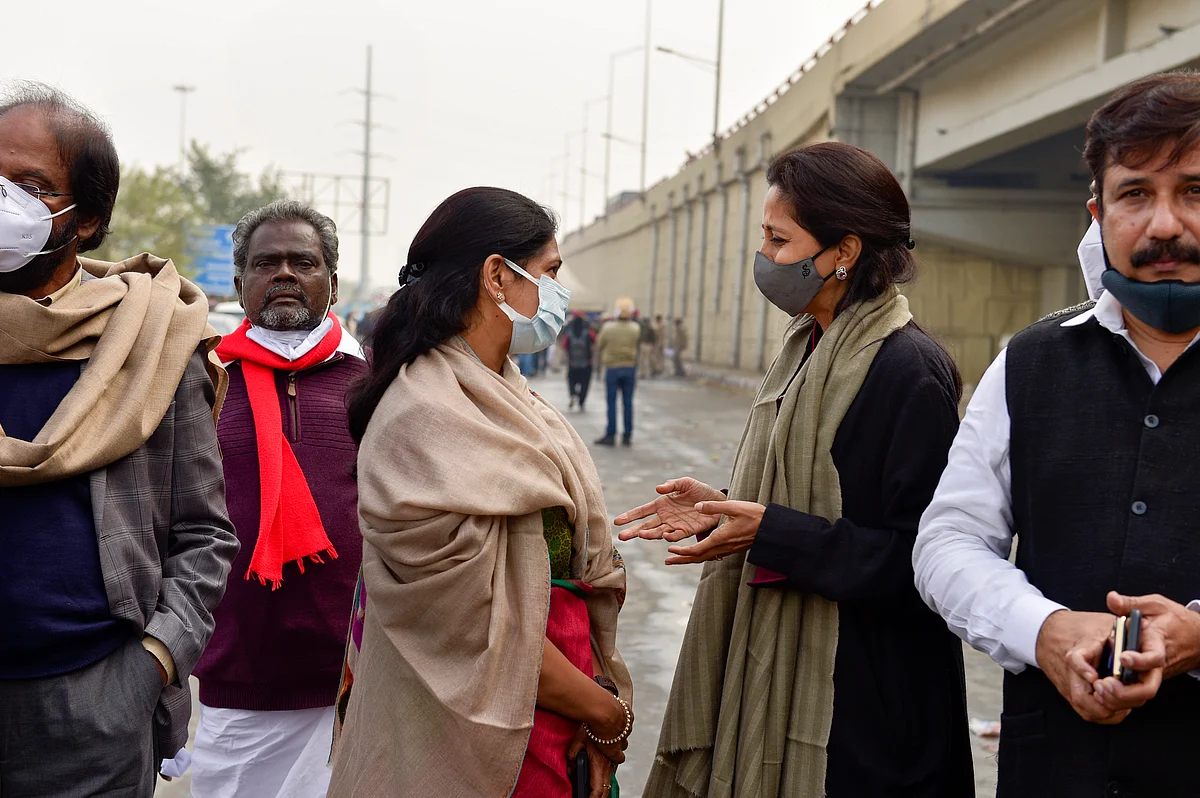Nationalist Congress Party (NCP) leader Supriya Sule interacts with Dravida Munnetra Kazhagam (DMK) leader Kanimozhi Karunanidhi during their visit to Ghazipur border, in solidarity with the farmers’ agitation against Centre’s farm reform laws.