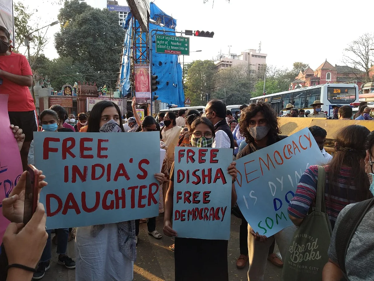 Young people carry placards in solidarity with Disha Ravi.