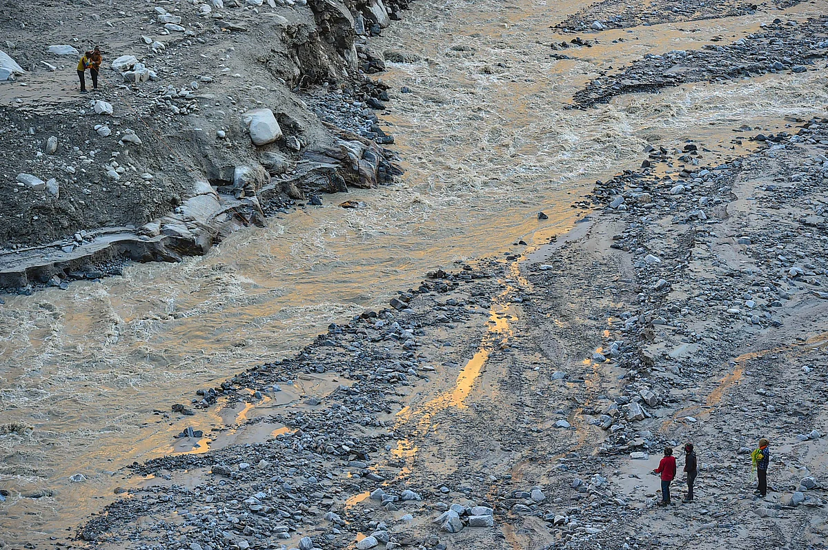 Local villagers on contract carry out rescue and restoration work near Reni village on Thursday, 11 February 2021, after Sunday’s glacier burst in Joshimath caused a massive flood in the Dhauli Ganga river, in Chamoli district of Uttarakhand.