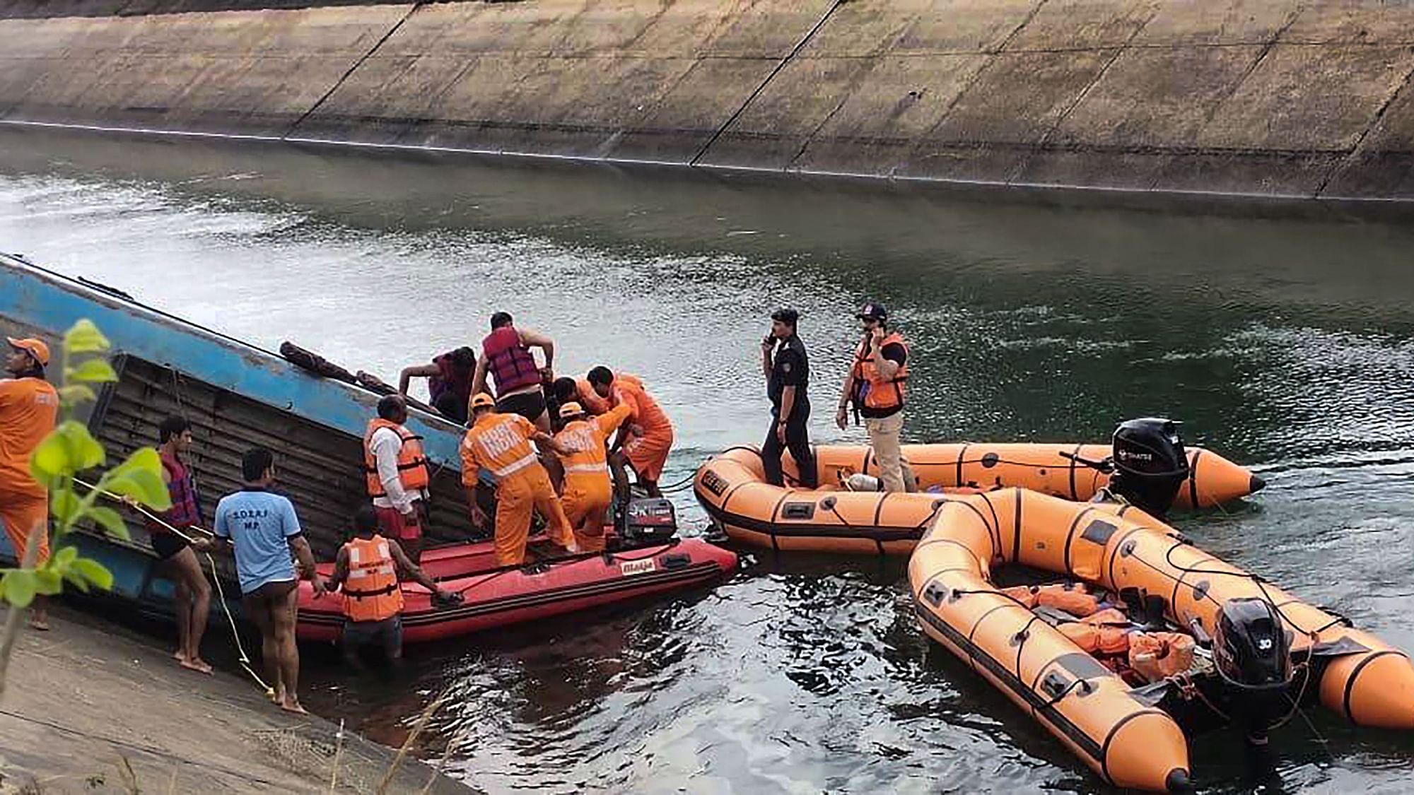 NDRF team carries out rescue operation after an overcrowded bus plunged into a canal in Sidhi district of Madhya Pradesh, on Tuesday, 16 February.