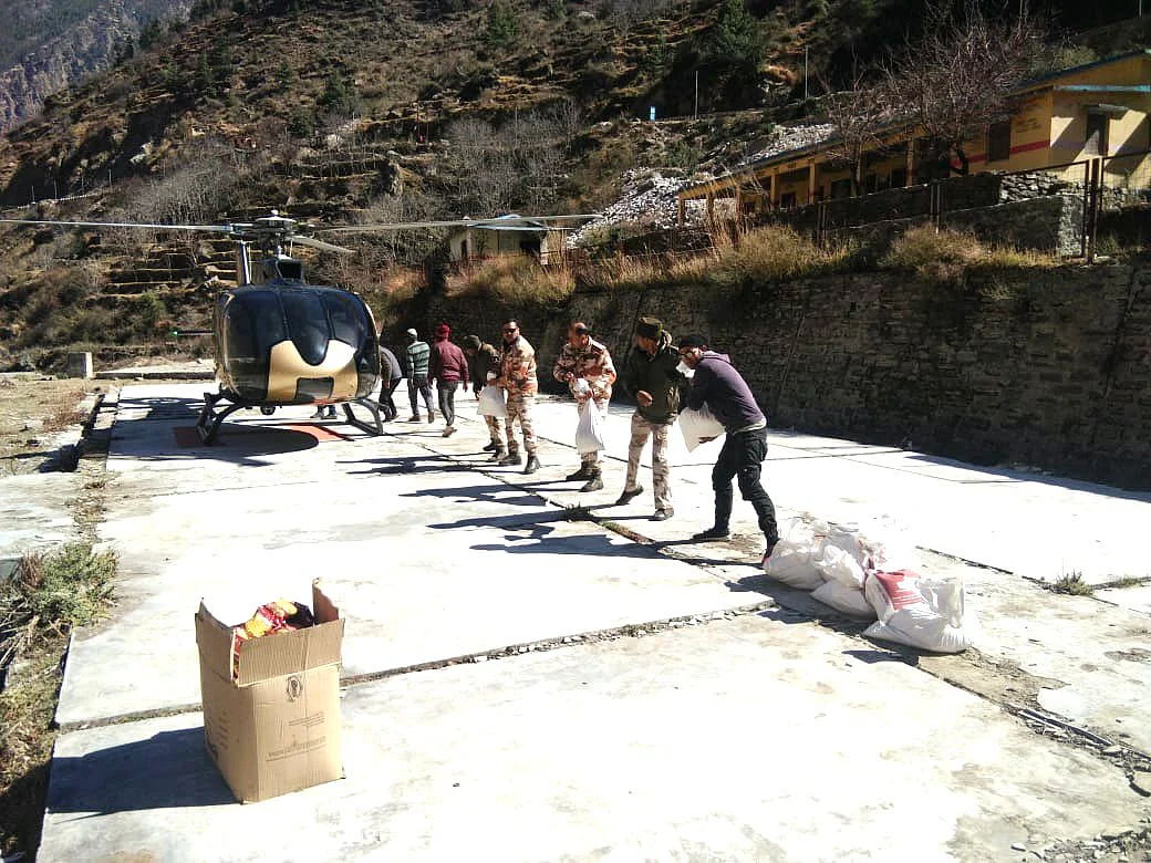 As Raini bridge was swept away by the flood, ITBP personnel provided ration packets to the stranded people of about nine villages through choppers in Uttarakhand.
