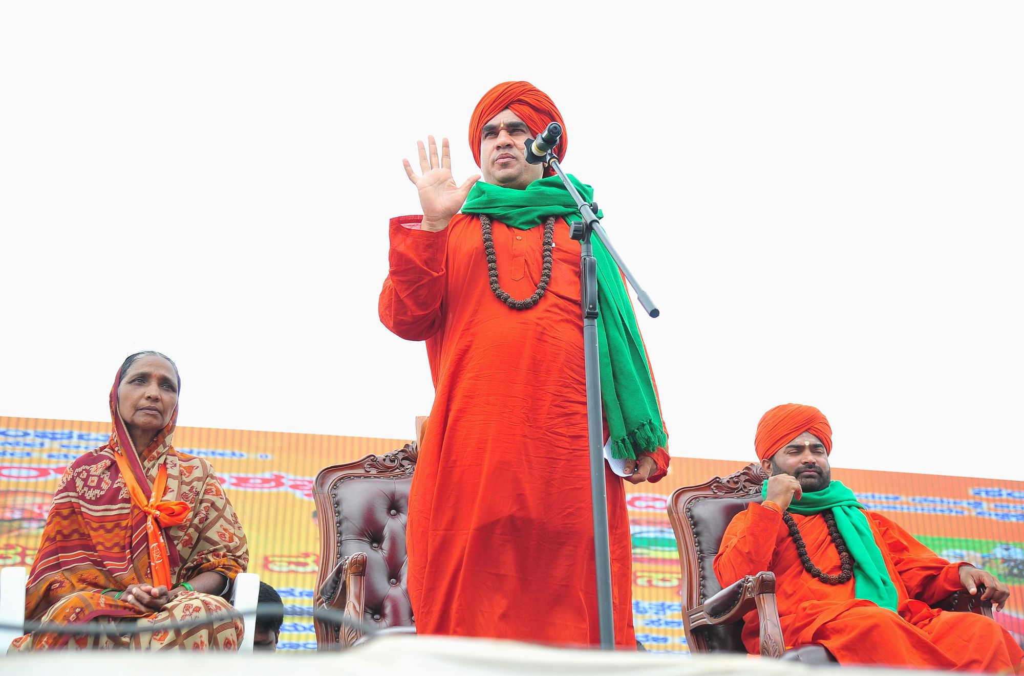 Sri Jaya Mruthyunjaya Swami speaks as Sri Vachanananda Swami (R) looks on during the Panchamasali convention to demand for the inclusion of Lingayat community in the 2A reservation category, in Bengaluru on Sunday.