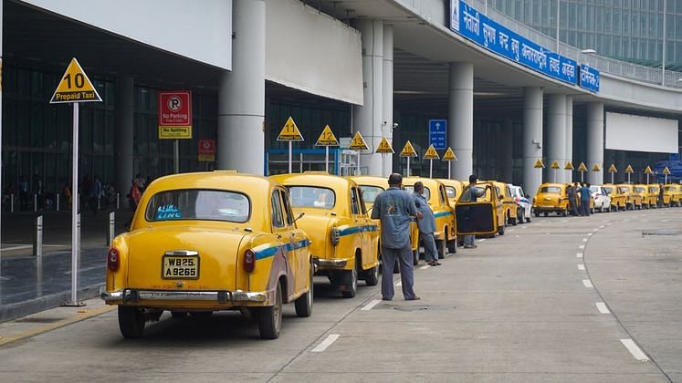 Iconic yellow Ambassador taxis waiting for passengers in Kolkata. Image used for representational purposes.