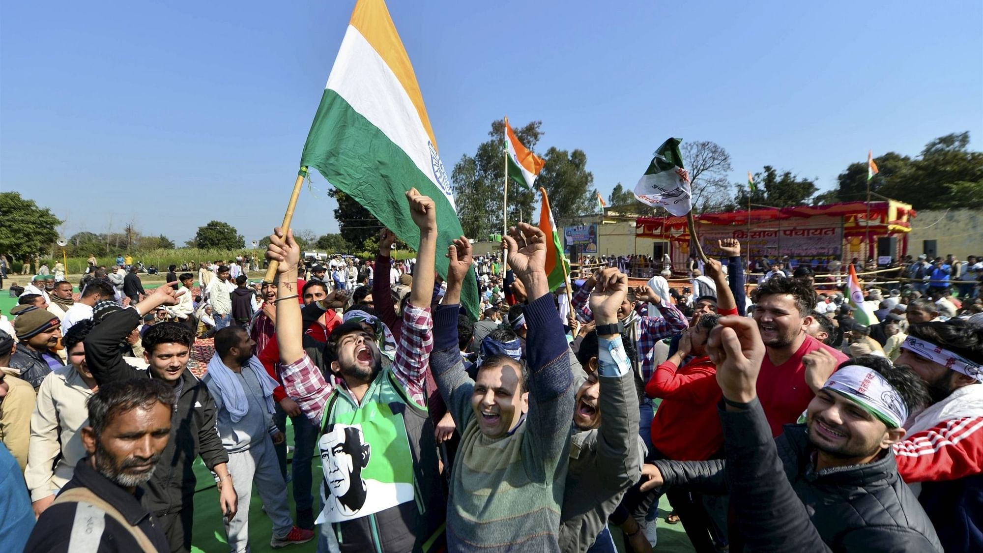 Farmers raise slogans as they arrive to attend a Mahapanchayat, organised by Rashtriya Lok Dal (RLD), and other unions to mobilise support for the ongoing farmers agitation against Centres farm reform laws, in Shamli, Friday, 5 February.&nbsp;