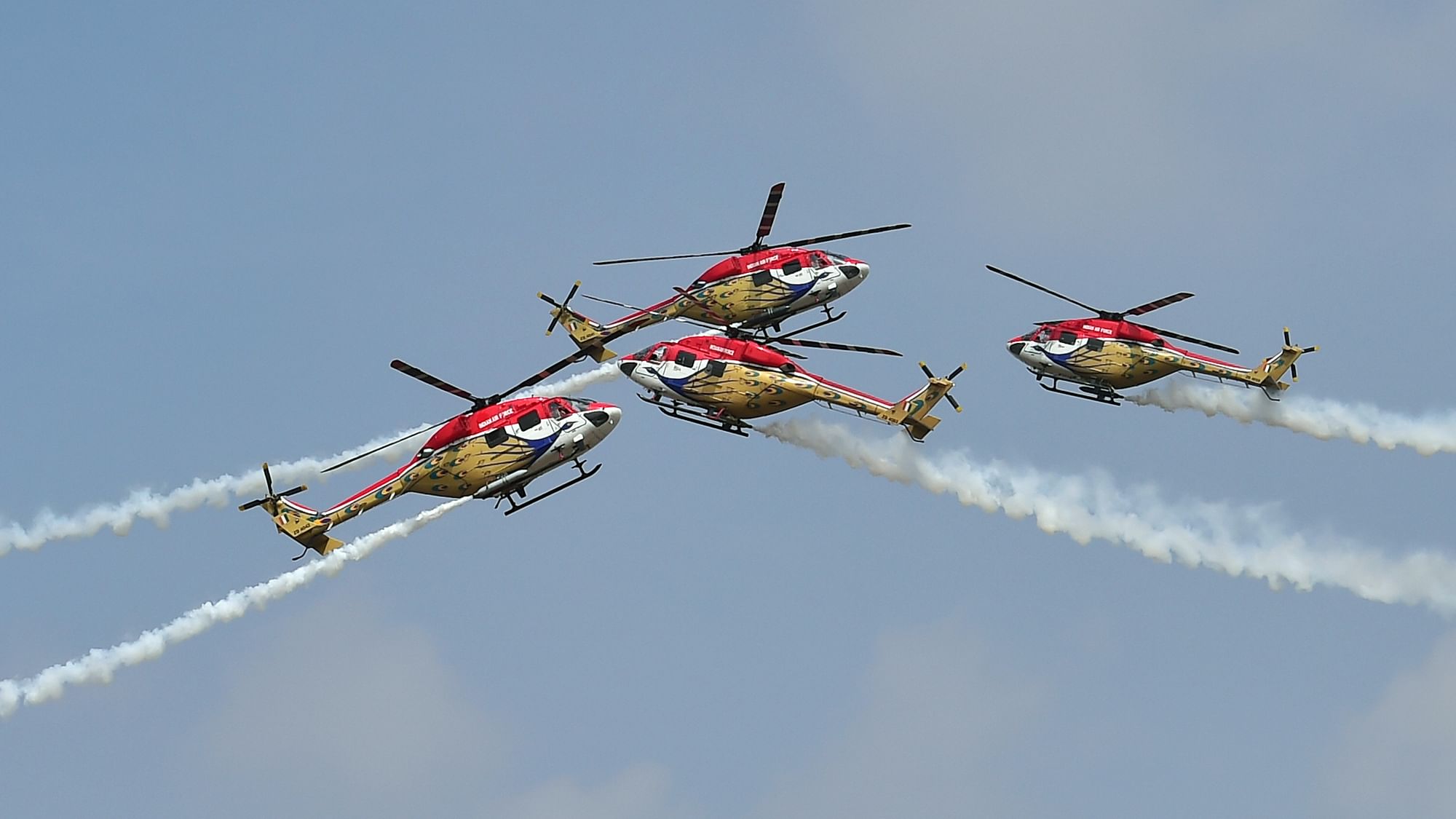 Indian Air Force’s aerobatic team ‘Sarang’ performs during the inauguration of the 13th edition of Aero India, at Yelahanka air base in Bengaluru, Wednesday, 3 February, 2021.