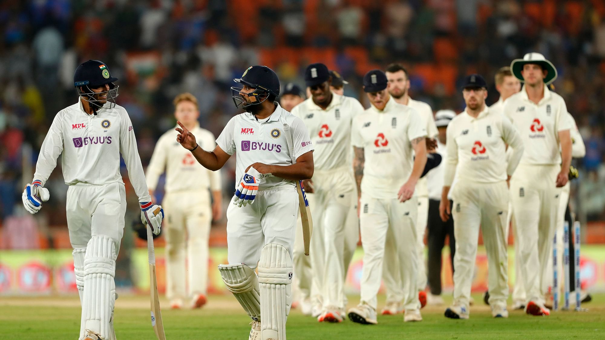 Rohit Sharma of India and Shubman Gill of India coming out after winning the match during day two of the third PayTM test match between India and England.