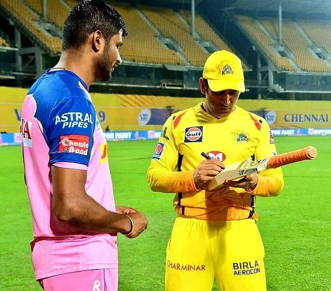 K Gowtham with MS Dhoni. 