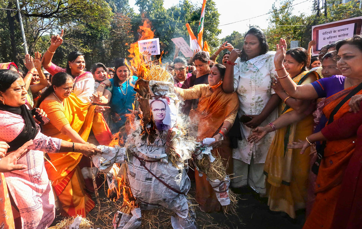  Bhopal Mahila Congress activists burn an effigy of Madhya Pradesh Chief Minister Shivraj Singh Chouhan during a protest against alleged crimes faced by women, at PCC headquarters in Bhopal, Wednesday, 24 February 2021.