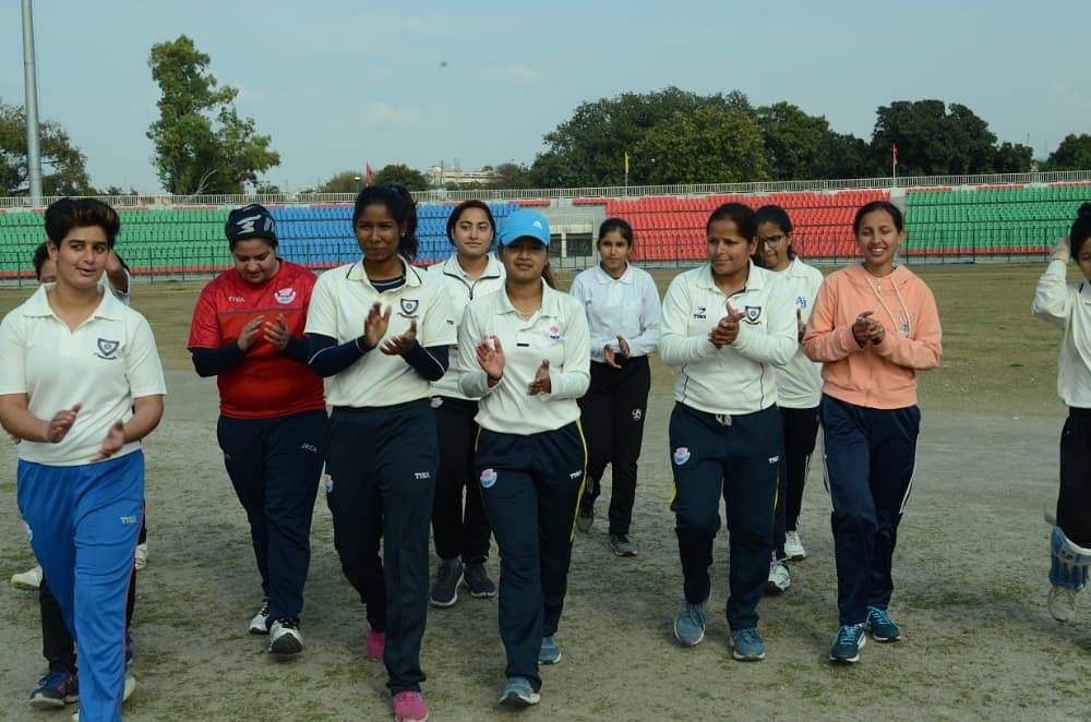 Young players on the sidelines of the Nari Shakti Cricket Pratiyogita in Jammu.