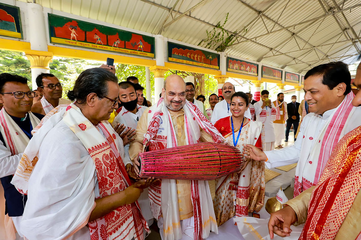 Union Home Minister Amit Shah plays an instrument inside Batadrava Than, the birthplace of Srimanta Sankardev, in Nagaon District of Assam, Thursday, 25 February, 2021.