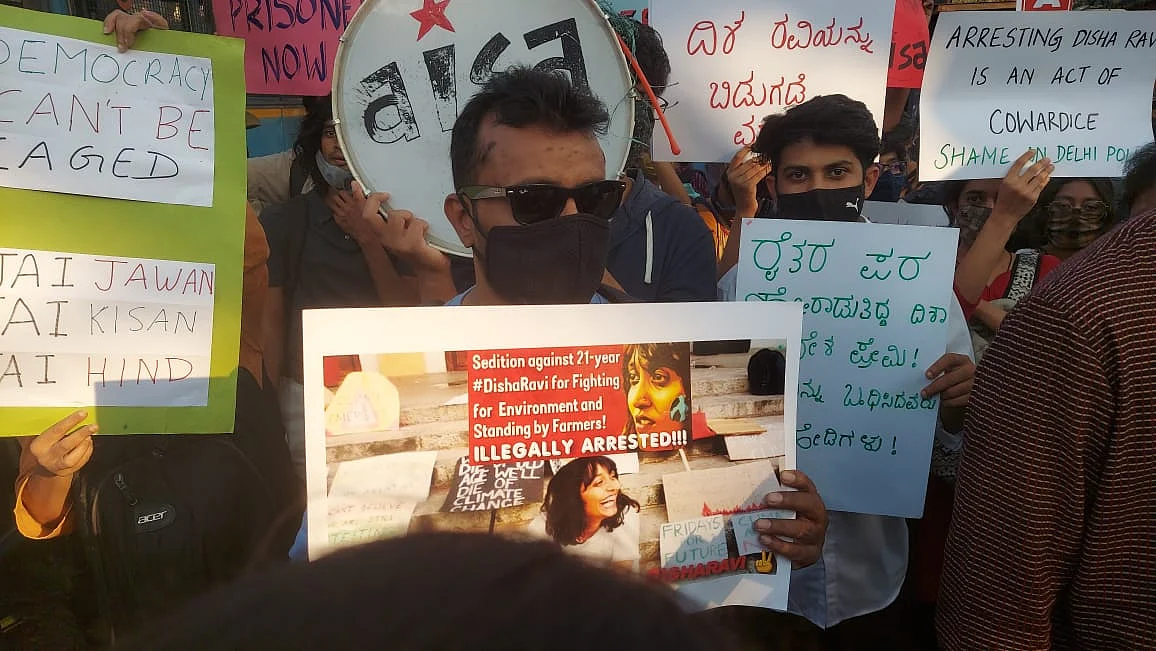 Young people carrying placards in solidarity with Disha Ravi.