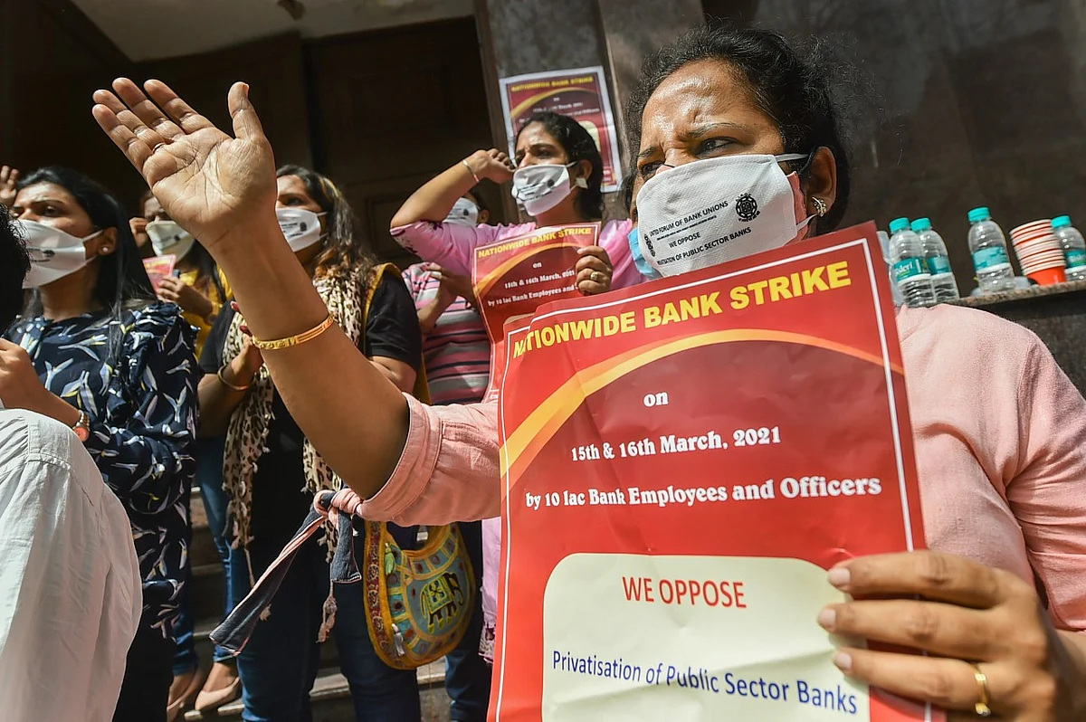 Bank employees raise slogans during a protest in support of the two-day nationwide strike, called by United Forum of Bank Unions (UFBU), against the proposed privatisation of two state-owned lenders, at Connaught Place.