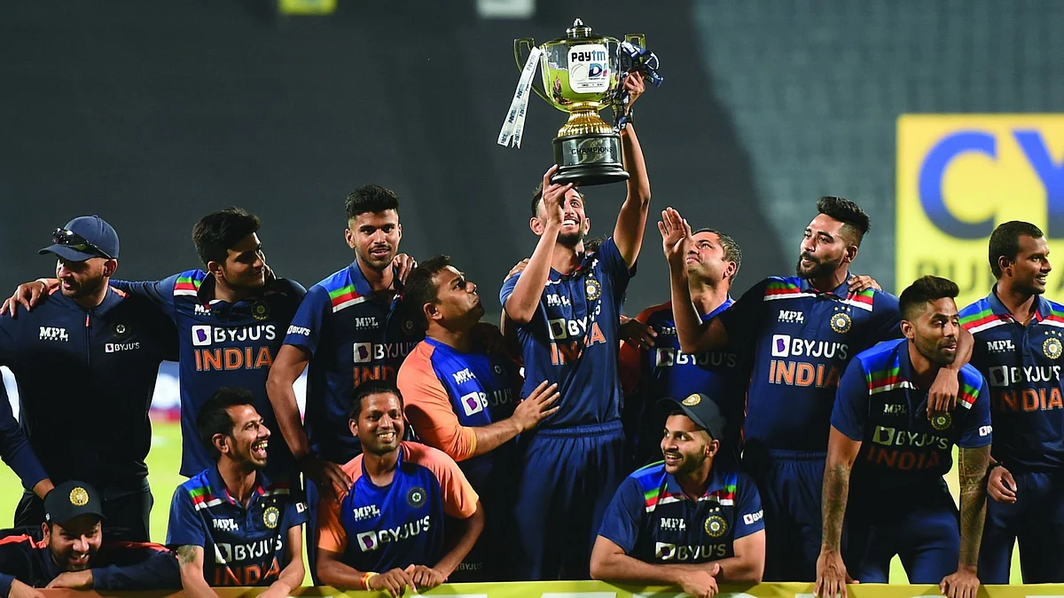 Indian team poses with the trophy after winning the ODI series against England, at Maharashtra Cricket Association Stadium in Pune, Sunday, March 28, 2021. 