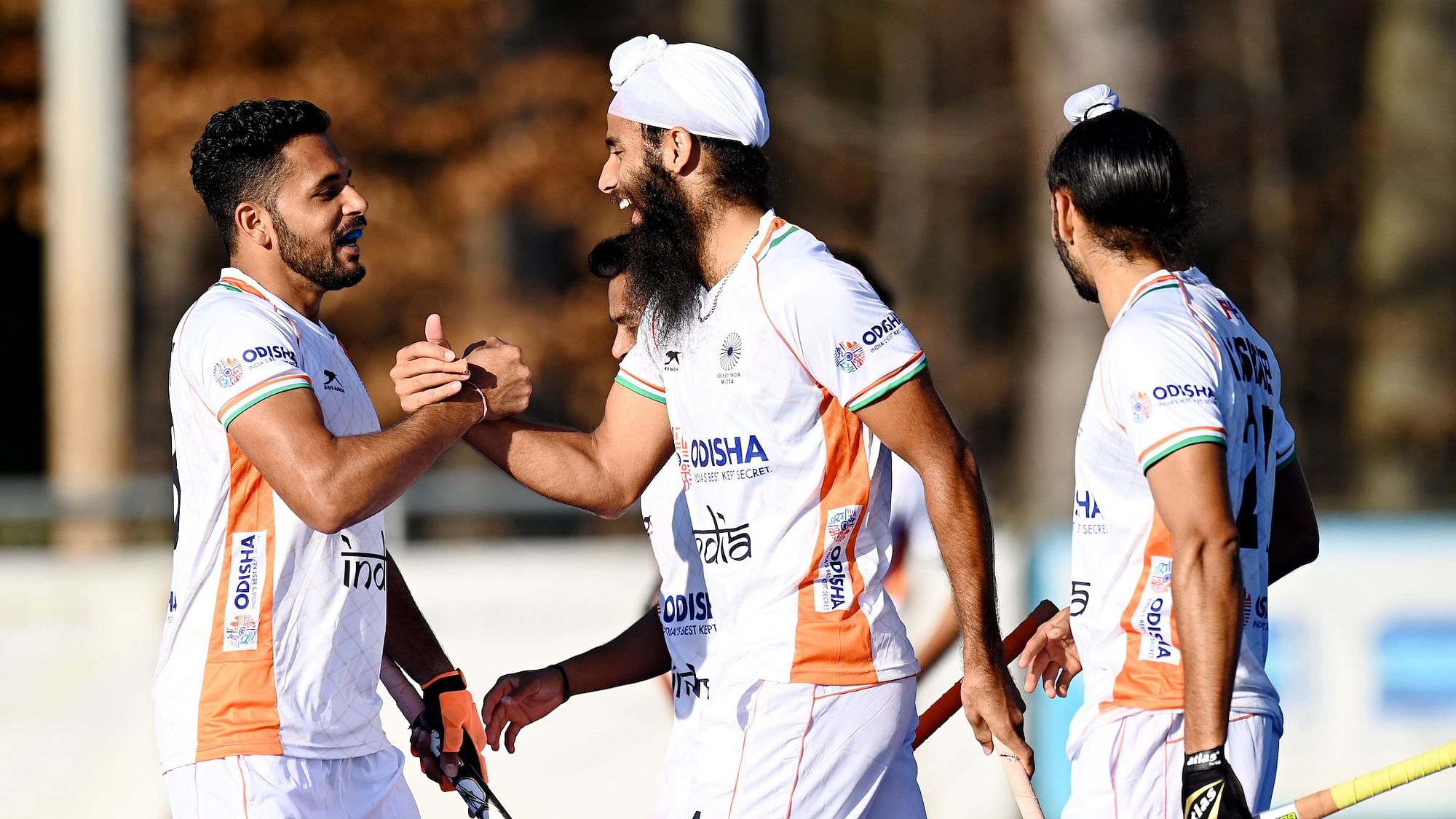 Jarmanpreet Singh celebrating with his teammates after scoring a goal