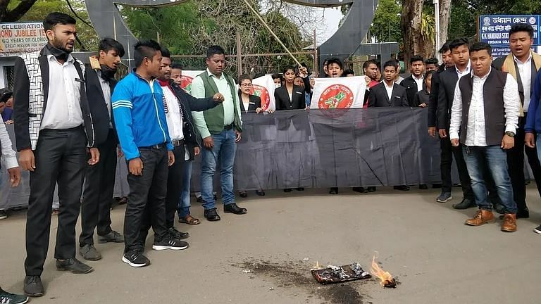Protesters burn copies of CAA in front of Tinsukia College in Assam