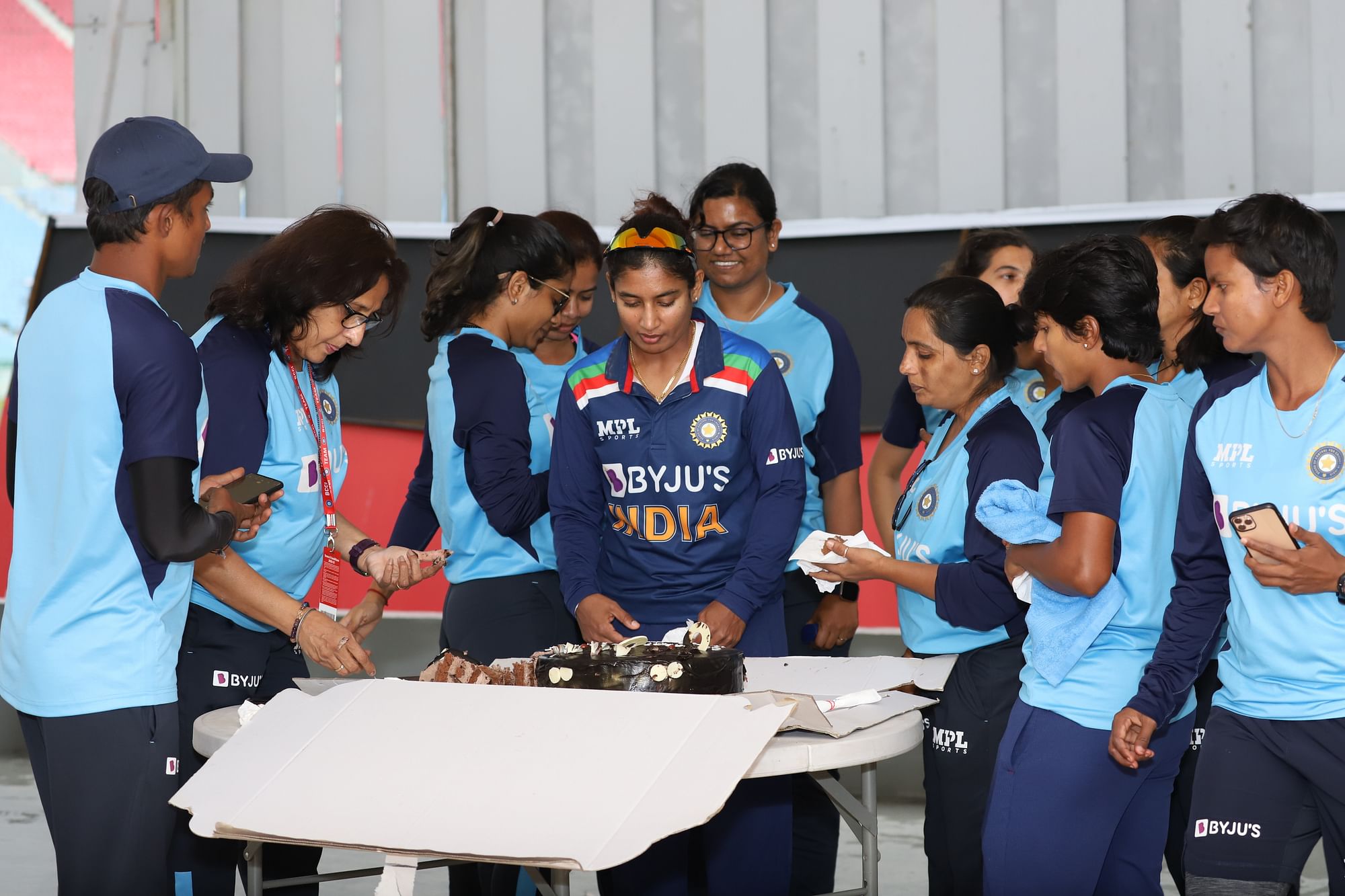 Mithali Raj cuts a cake to celebrate her 10,000 international runs.