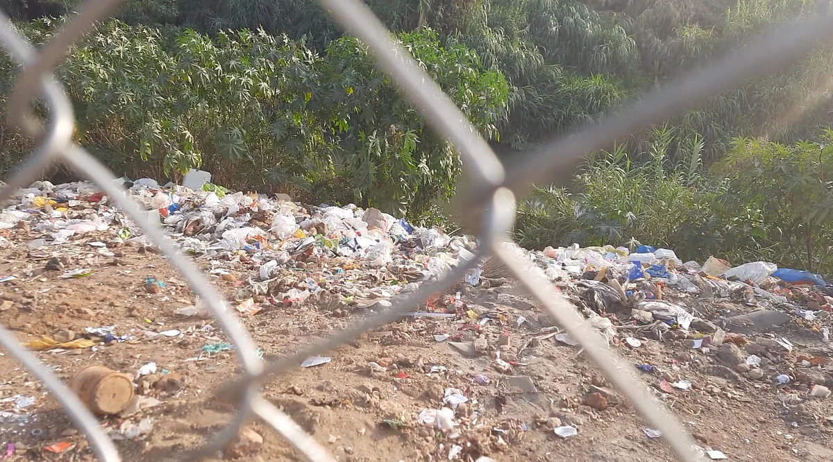 The Noyil river that passes through Karumbukadai has garbage accumulated on its banks.