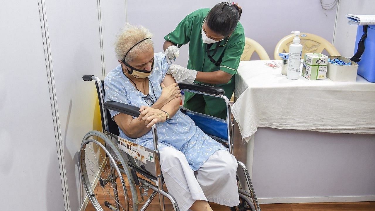  An elderly person being administered the COVID-19 vaccine, at the BKC jumbo vaccination centre in Mumbai on 1 March. &nbsp;