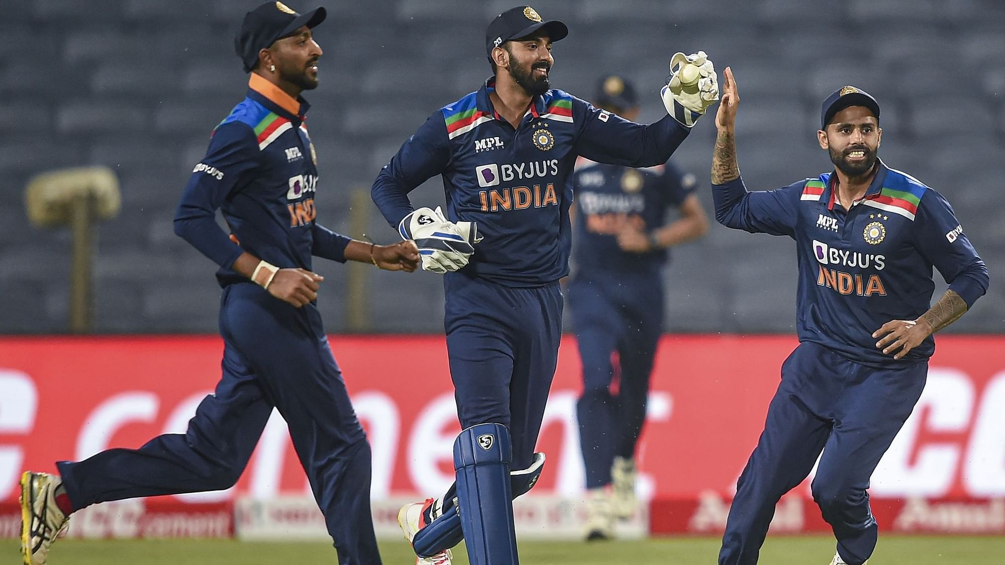 Pune: Indian cricketer Krunal Pandya, KL Rahul and Suryakumar Yadav celebrates the wicket of England cricketer Moeen Ali during the first One Day International cricket match between India and England.