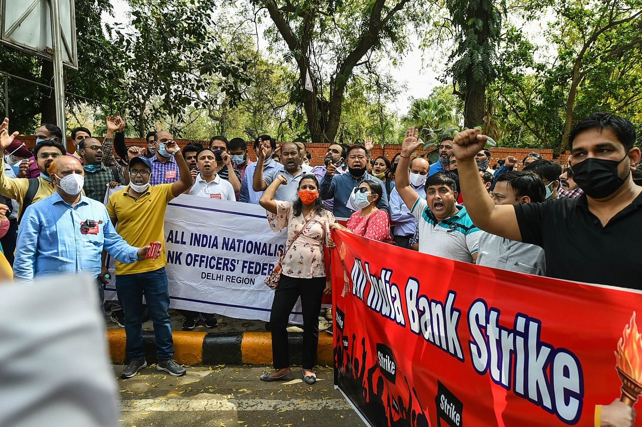 Bank employees raise slogans during a protest in support of the two-day nationwide strike, called by United Forum of Bank Unions (UFBU), against the proposed privatisation of two state-owned lenders, at Jantar Mantar.