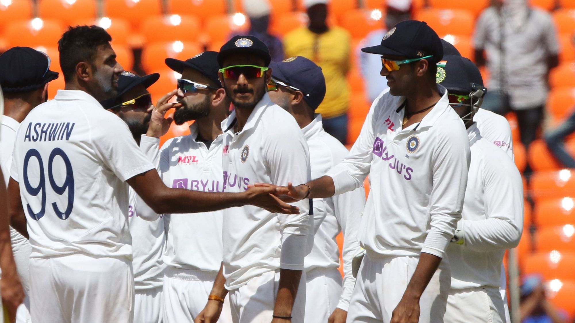 R Ashwin and India celebrate the wicket of Joe Root on Day 3.