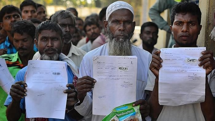 File photo of people showing their acknowledgement receipts after checking their names in a draft for NRC, in Guwahati. Image used for representation purposes only.