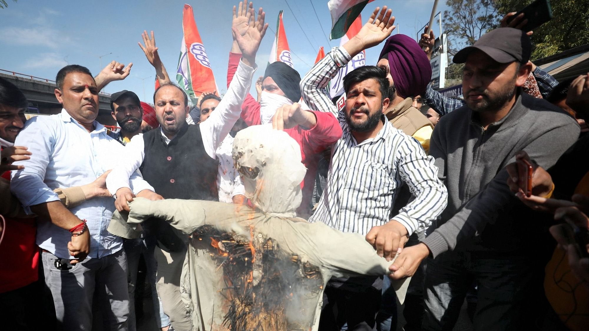 Congress activists burn an effigy of senior party leader Ghulam Nabi Azad during a protest, in Jammu, Tuesday, March 2, 2021.
