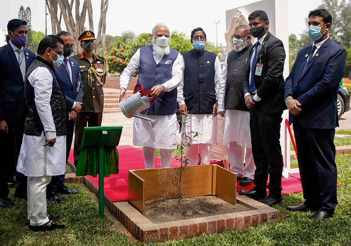 Prime Minister Narendra Modi plants Arjuna Tree sapling at Savar, on the occasion of 50th Independence Day of Bangladesh, in Dhaka, Friiday, March 26, 2021 
