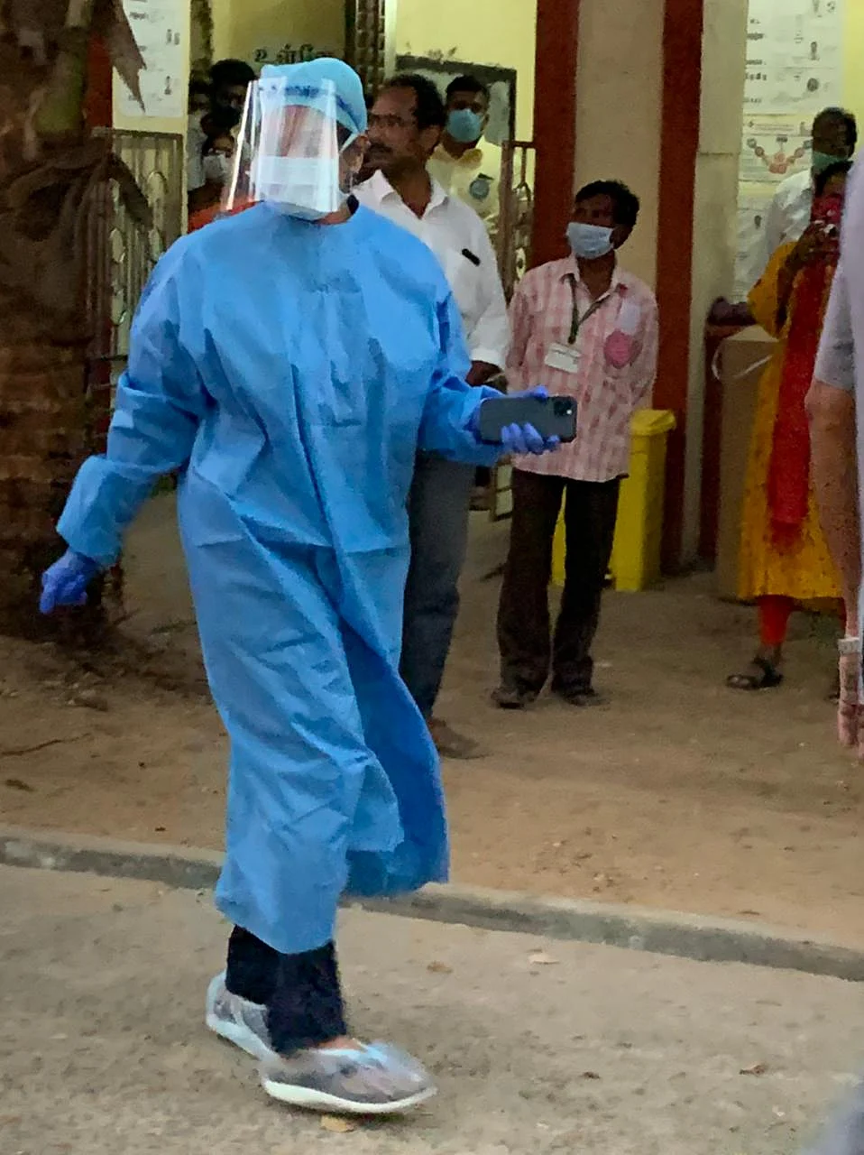 DMK’s Kanimozhi Karunanidhi in a PPE suit reaches a voting centre by an ambulance to cast her vote.