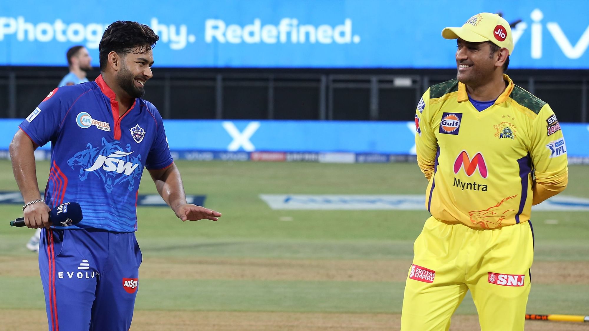 Rishabh Pant and MS Dhoni share a light moment before the toss.&nbsp;